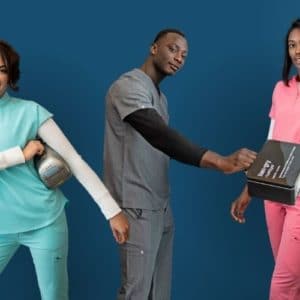 Three people in nurse scrubs with lunch boxes